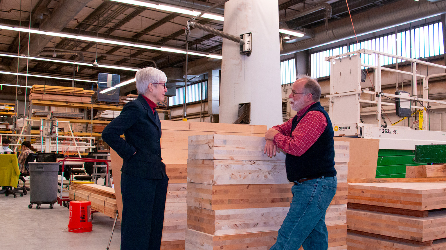 Valerie Thomas and Russell Gentry talk in front of mass timber components