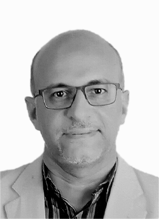 This is a grayscale portrait of Dr. Abdelmohsen, he is smiling towards the camera against a light background.